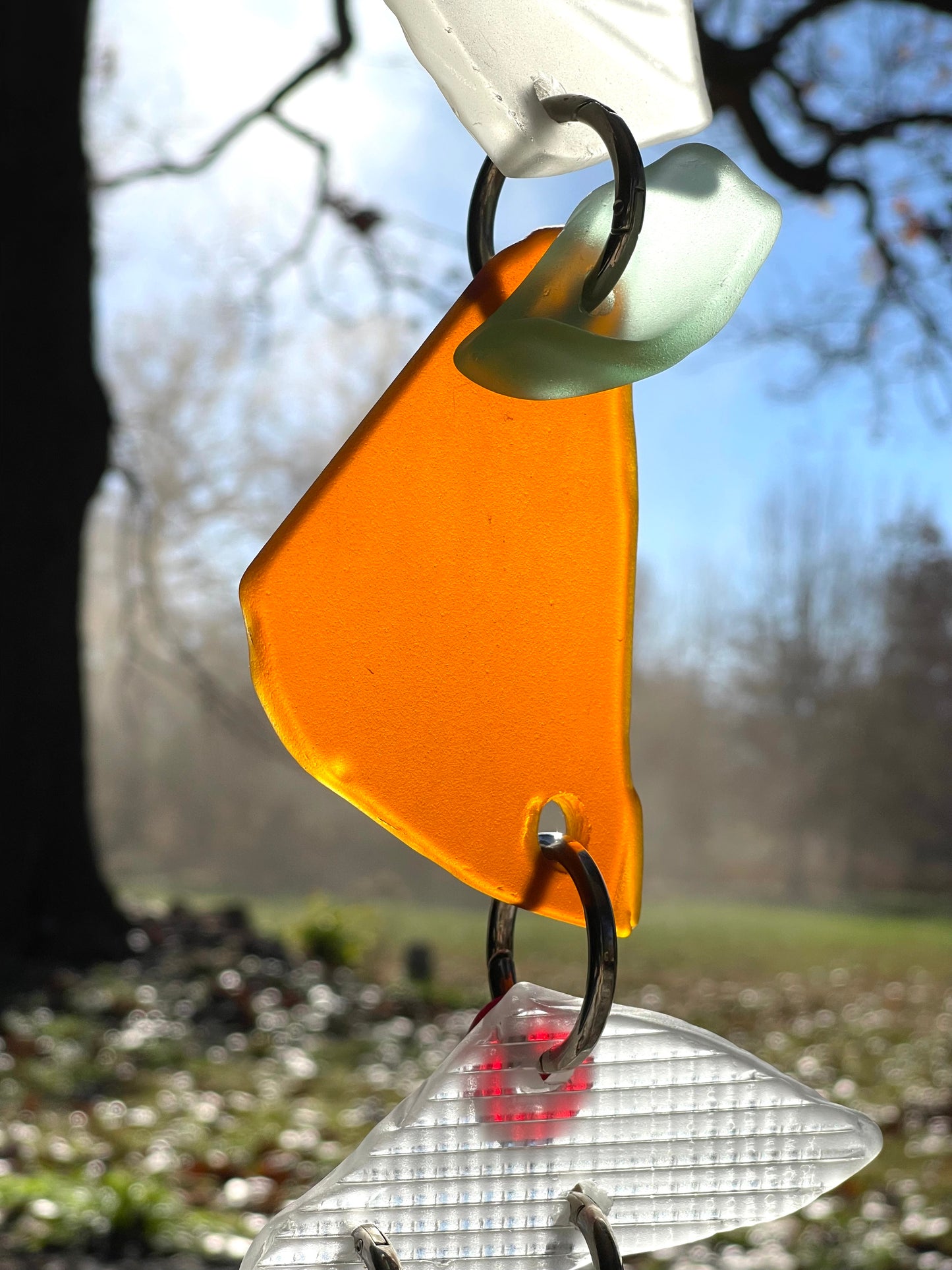 Chunky repurposed glass sun catcher, glows warmly in sunlight