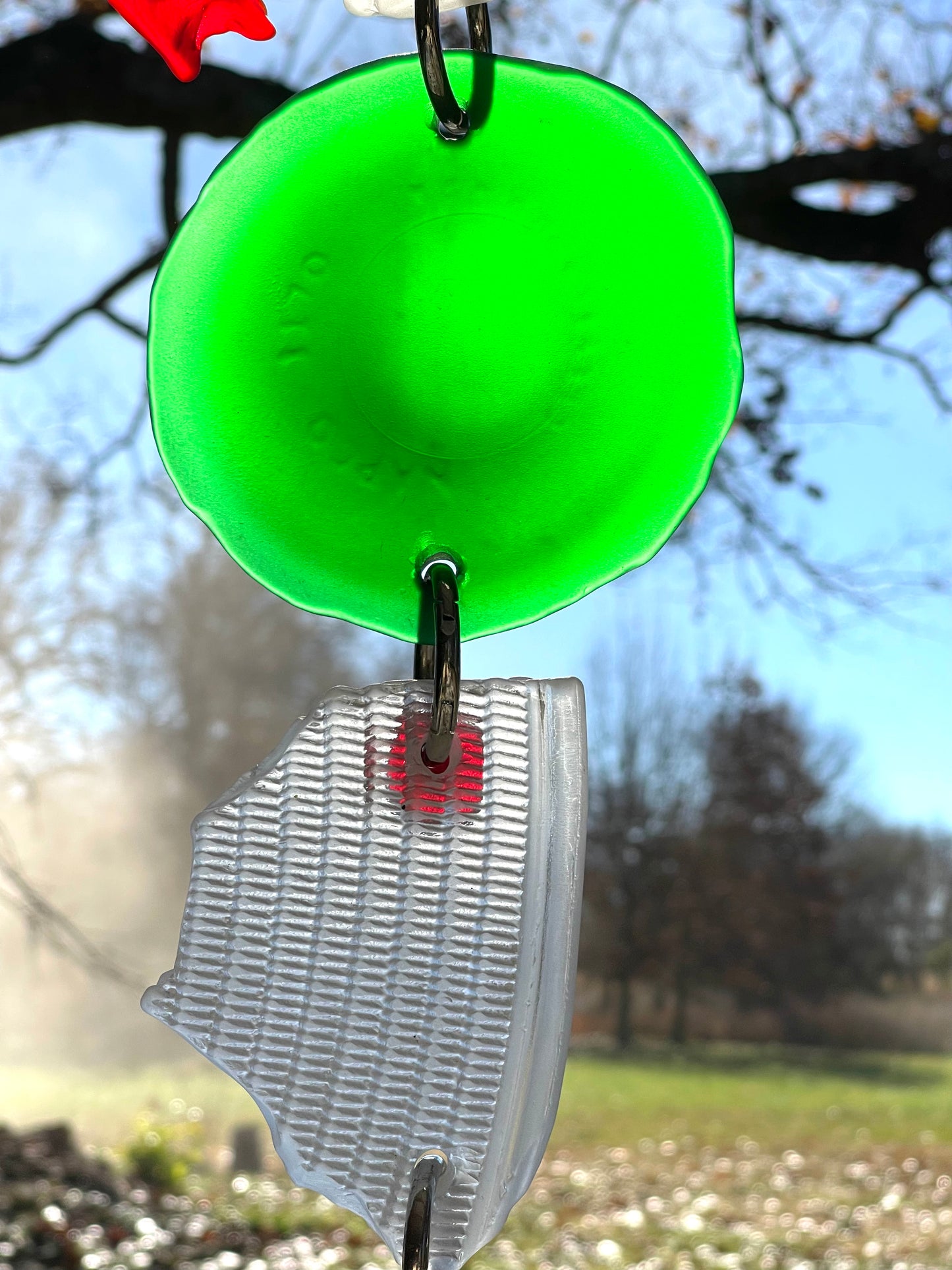 Chunky repurposed glass sun catcher, glows warmly in sunlight
