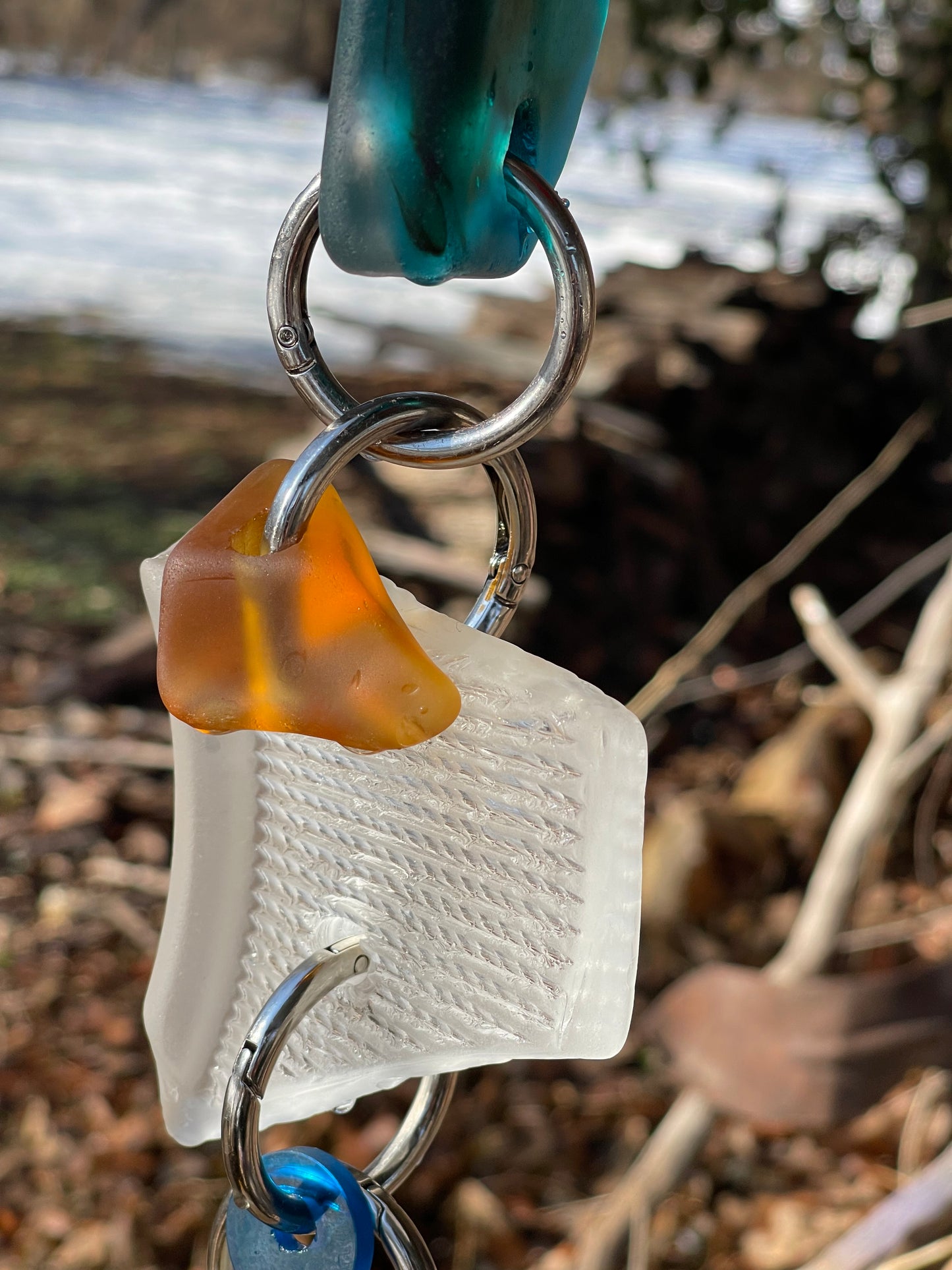 Chunky repurposed glass sun chain with a sweet bruise that glows warmly in sunlight